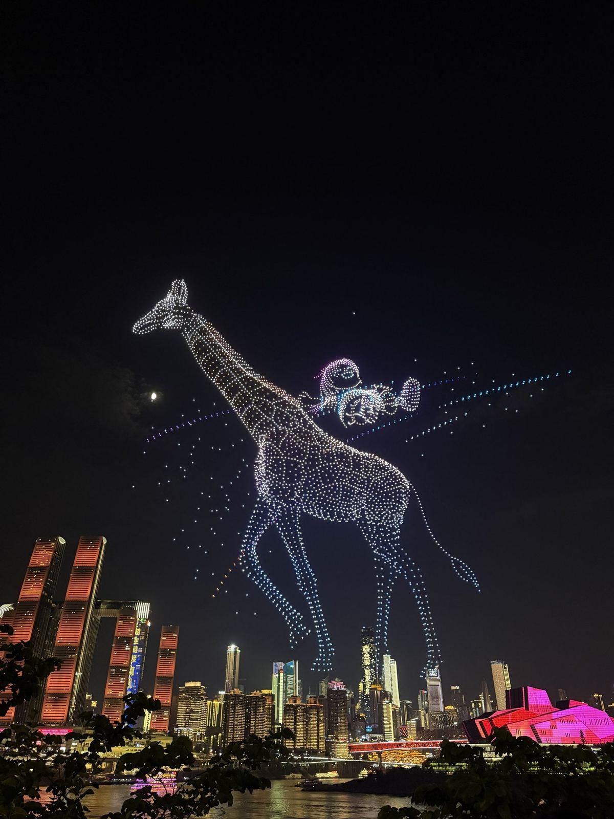 A giraffe drawn by thousands of drones above Raffles City, Chongqing drone show