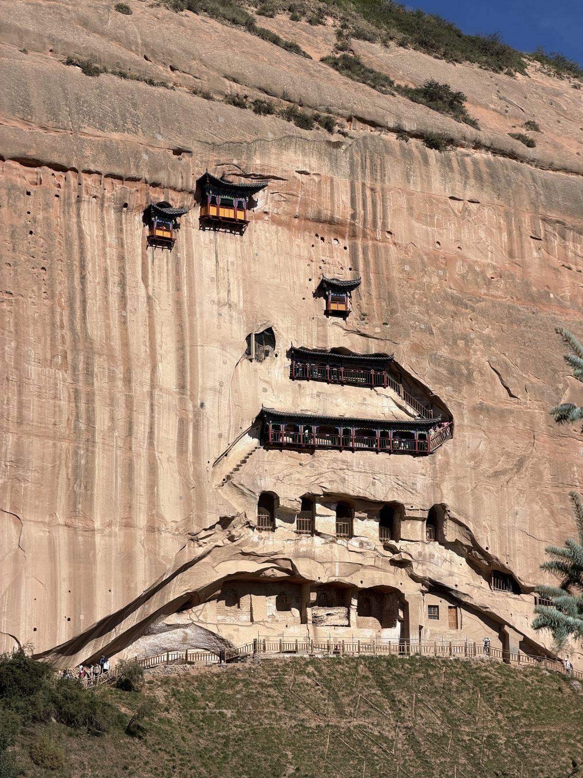 Painted pavilions hanging on the red sandstone cliff of Mati Temple